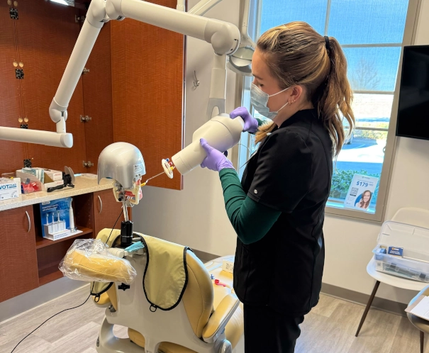 Dental assistant student in training program