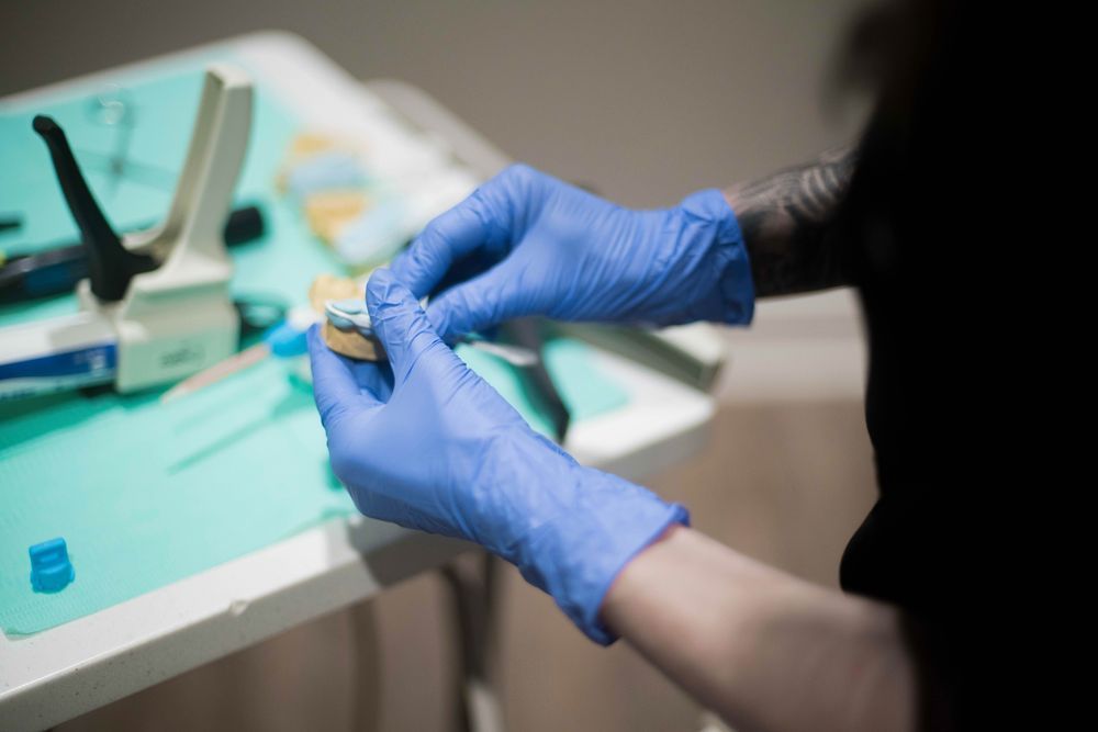 Dental Assistant Cleaning Dental Instruments