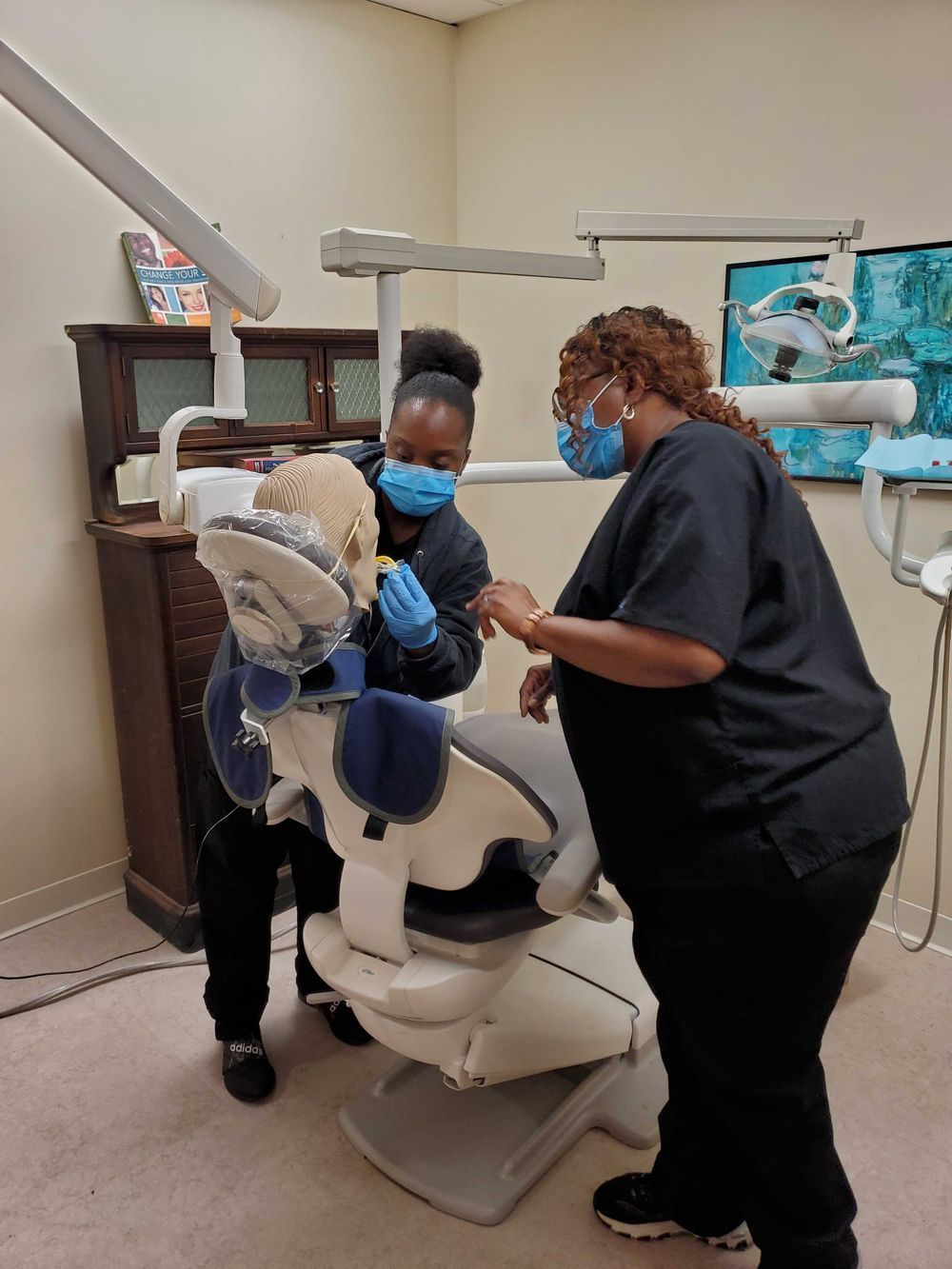 Dental assistant students in school training